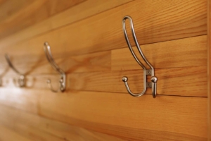 Wall lined with a coat hook design.